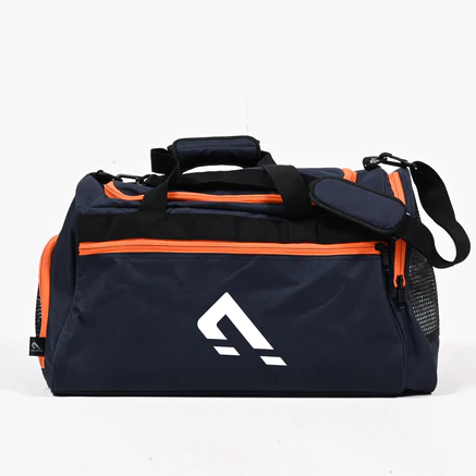 An orange painted blue, cut in half laying on a blue background